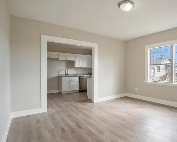 a view of a kitchen with a sink cabinets and a window