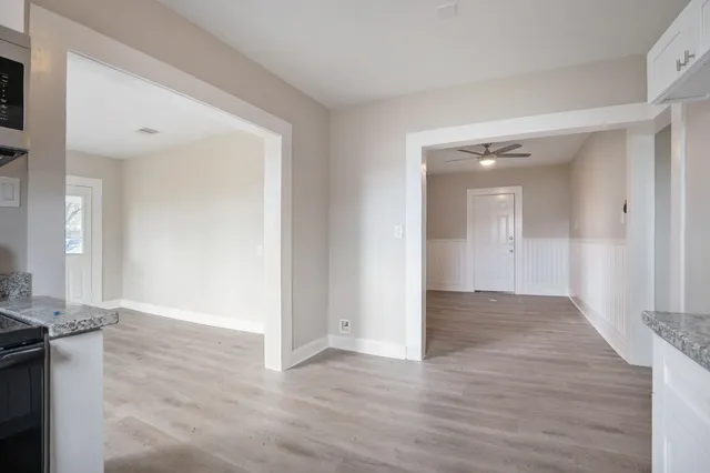 wooden floor in a hall with an entryway