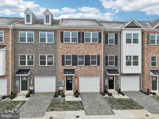 a front view of a building with garden