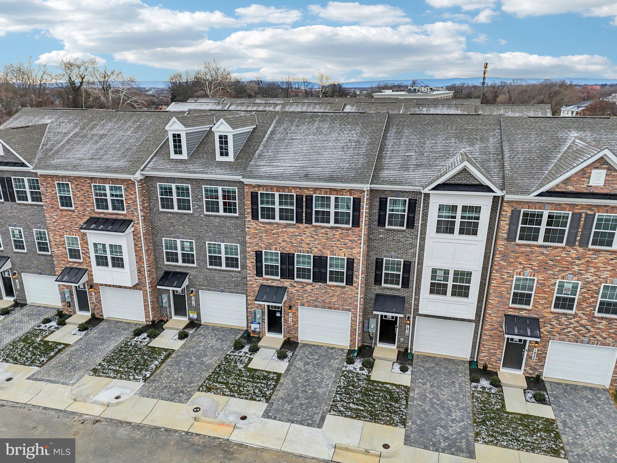 1818 Blythe Way Winchester, VA 22601 - Photo 44 of 45 a front view of a residential apartment building with a yard