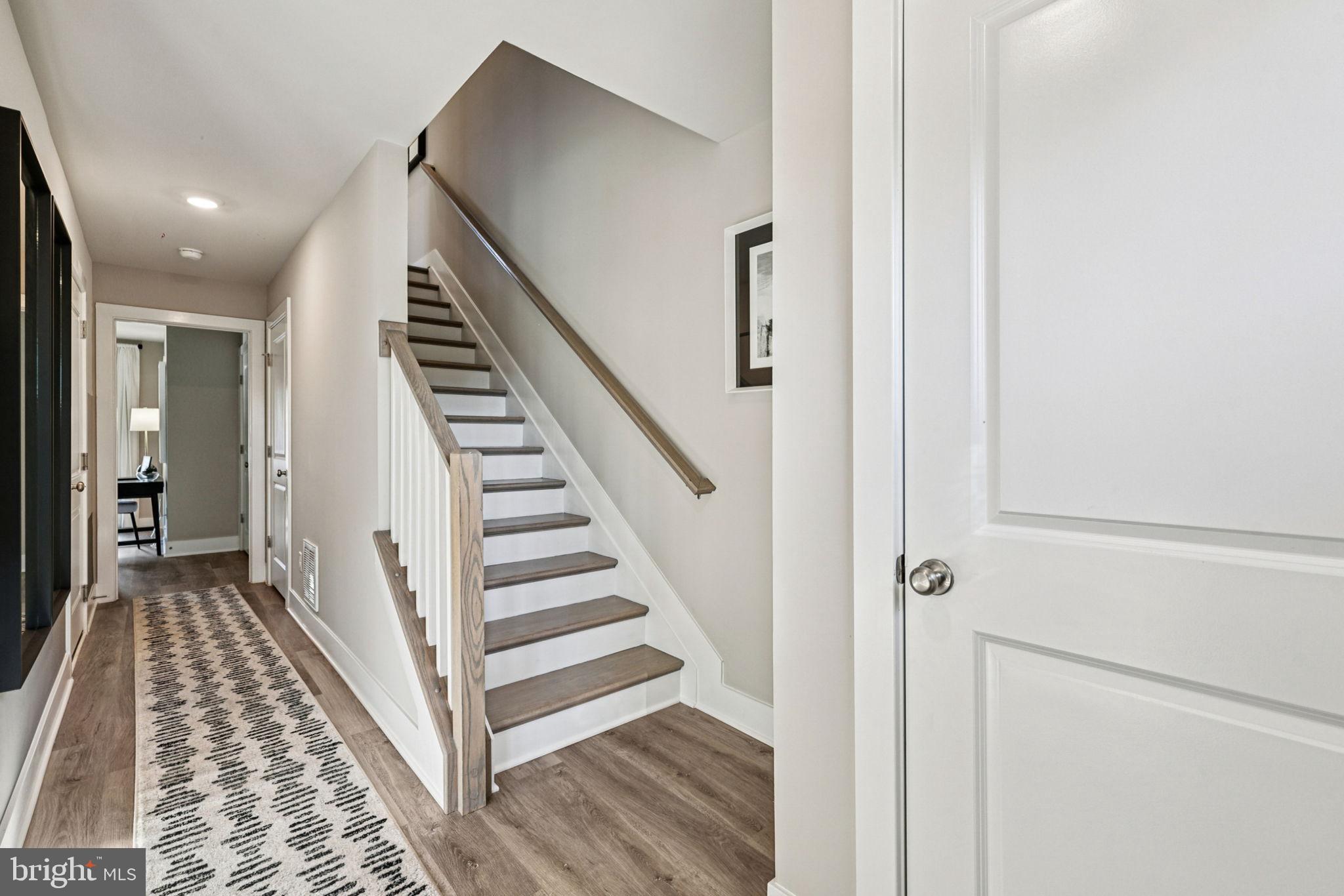 1818 Blythe Way Winchester, VA 22601 - Photo 7 of 45 a view of a hallway with wooden floor and entryway