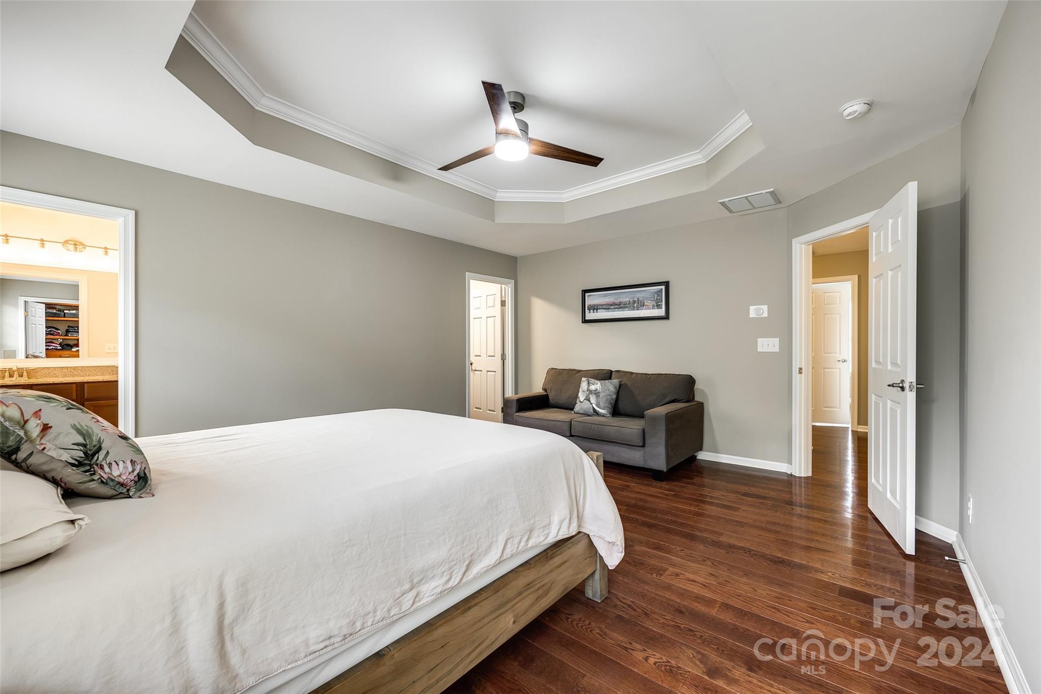 127 Inlet Point Drive Fort Mill, SC 29708 - Photo 16 of 46 a bedroom with a bed and wooden floor