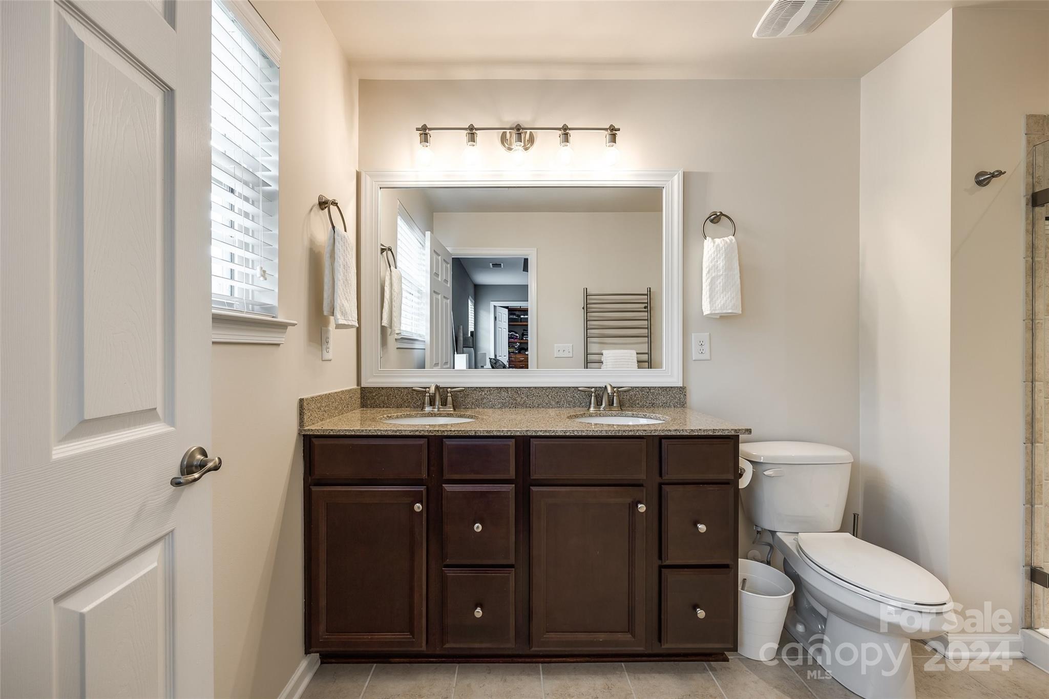 127 Inlet Point Drive Fort Mill, SC 29708 - Photo 19 of 46 a bathroom with a toilet a sink and mirror