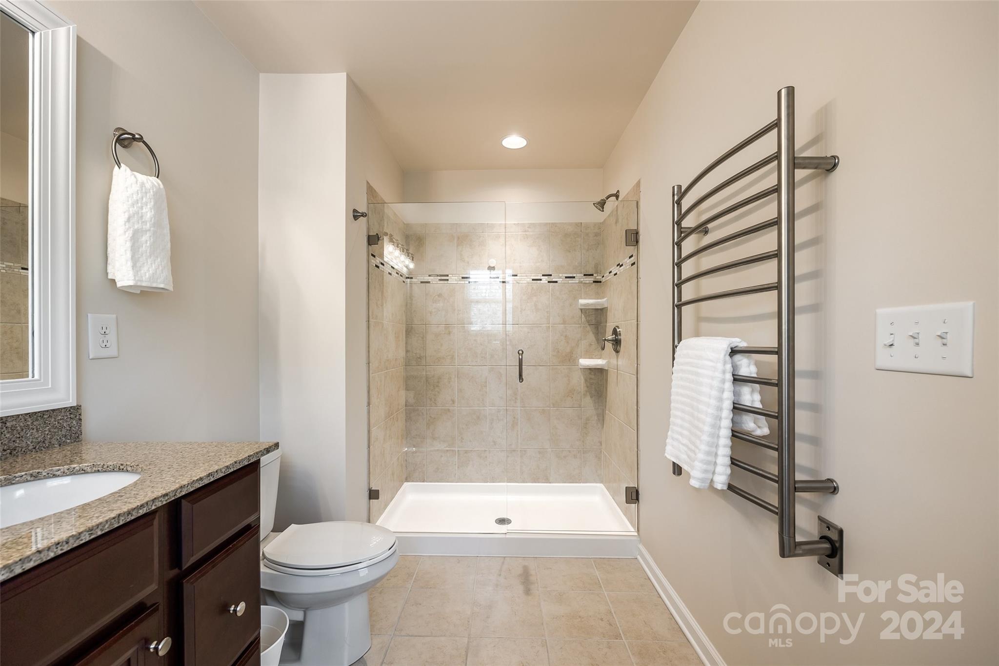 127 Inlet Point Drive Fort Mill, SC 29708 - Photo 20 of 46 a bathroom with a sink a toilet and shower
