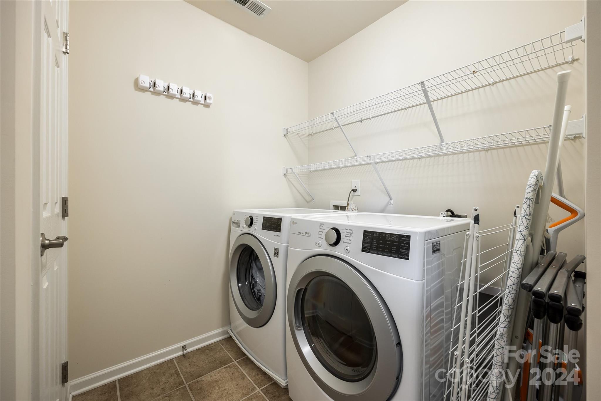 127 Inlet Point Drive Fort Mill, SC 29708 - Photo 21 of 46 a view of a storage & utility room with dryer and washer