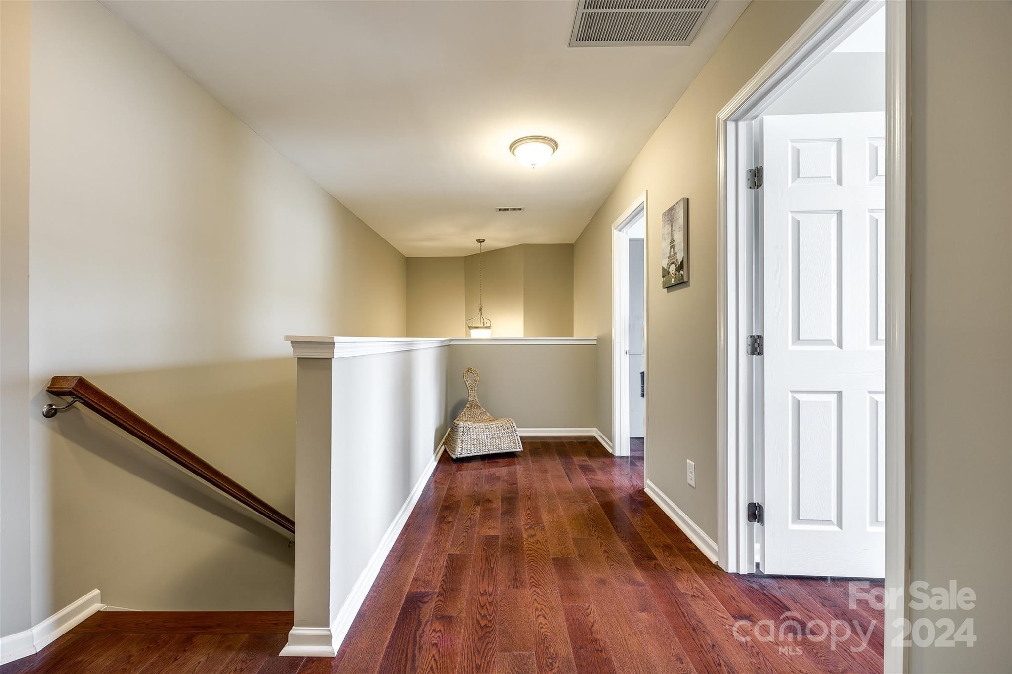 127 Inlet Point Drive Fort Mill, SC 29708 - Photo 22 of 46 a view of a hallway with wooden floor and staircase