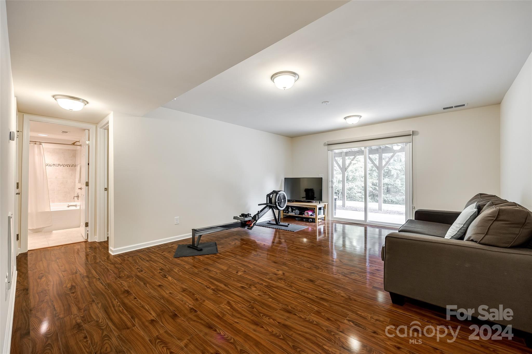 127 Inlet Point Drive Fort Mill, SC 29708 - Photo 24 of 46 a living room with furniture and a flat screen tv