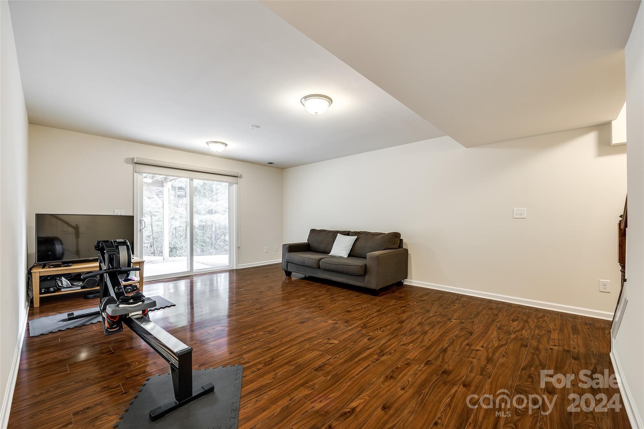 127 Inlet Point Drive Fort Mill, SC 29708 - Photo 25 of 46 a living room with furniture and a wooden floor