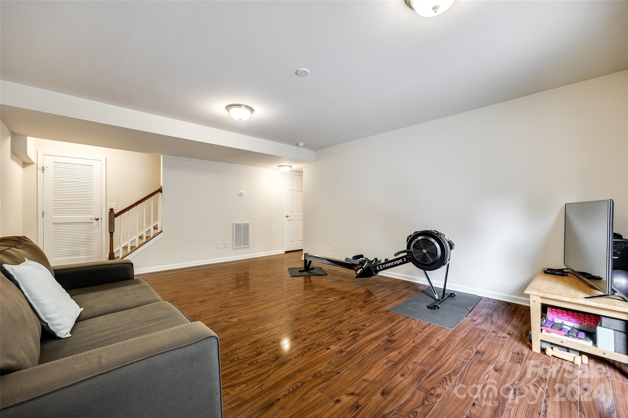 127 Inlet Point Drive Fort Mill, SC 29708 - Photo 26 of 46 a living room with furniture and a wooden floor