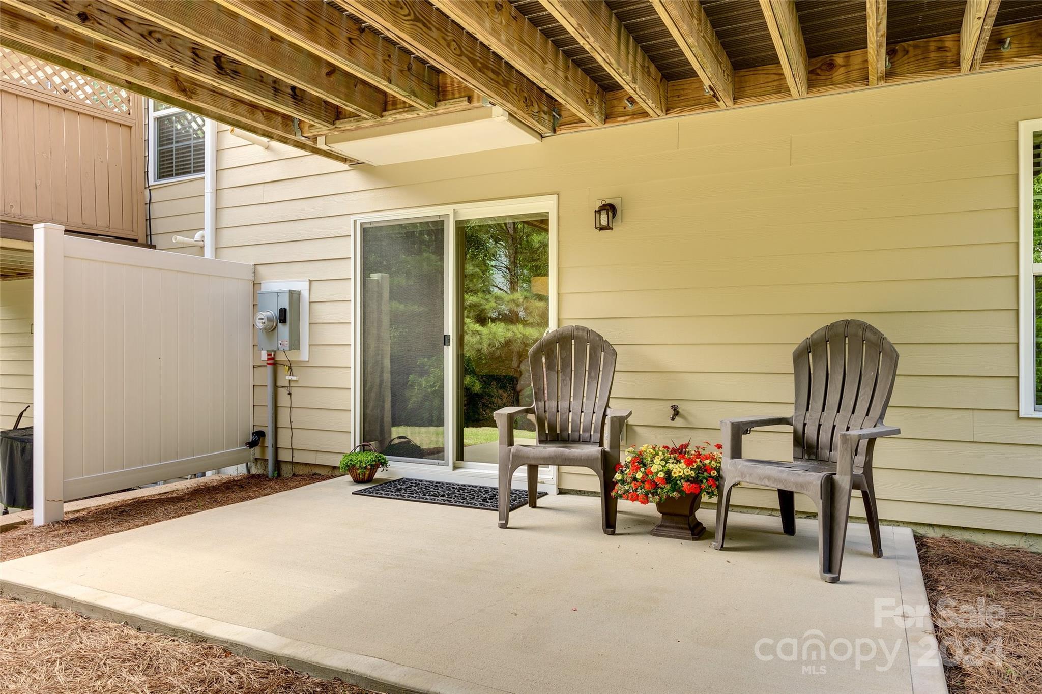 127 Inlet Point Drive Fort Mill, SC 29708 - Photo 30 of 46 a view of a front door with chair and tables