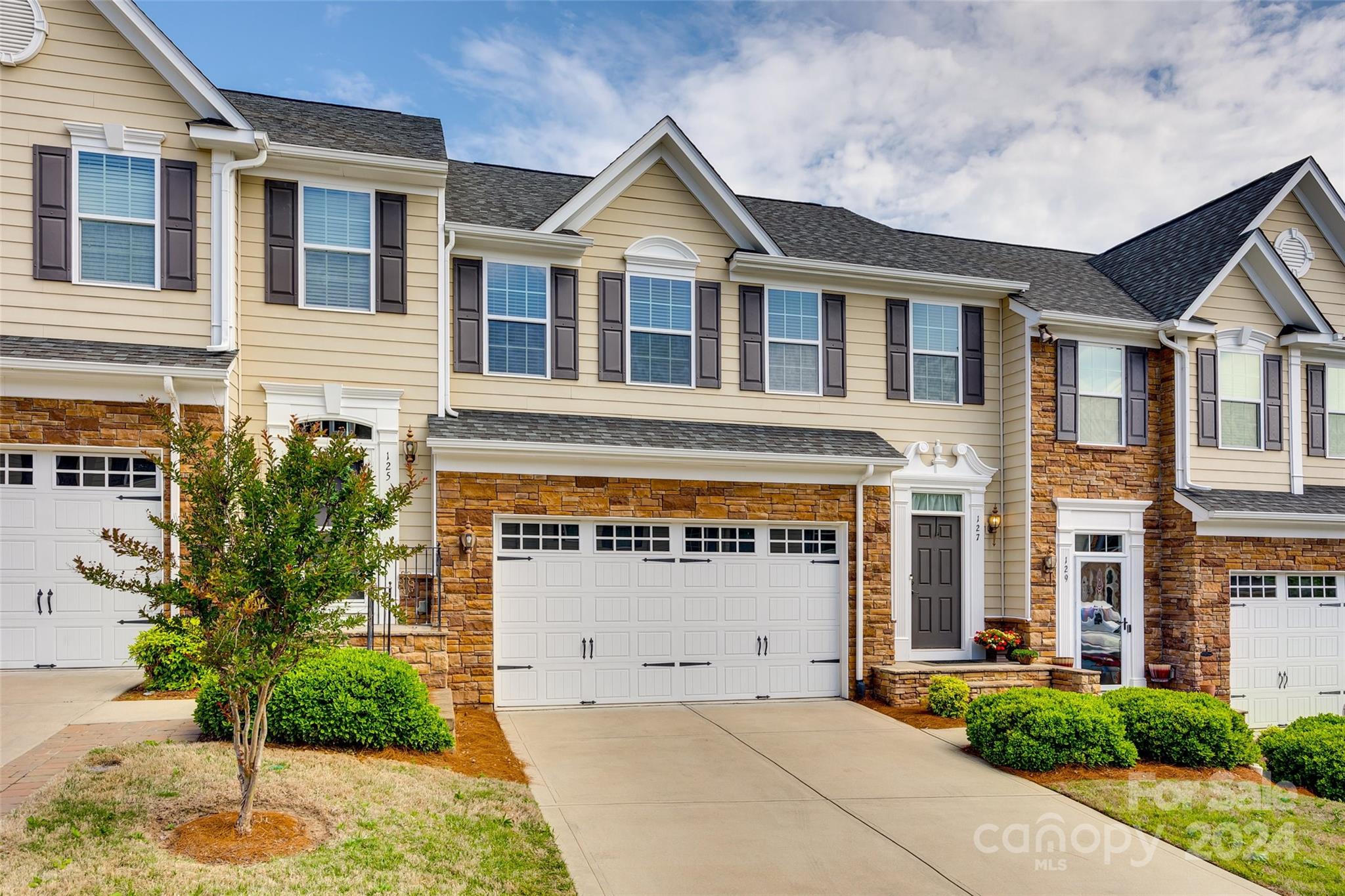 127 Inlet Point Drive Fort Mill, SC 29708 - Photo 33 of 46 a front view of a house with a yard and garage