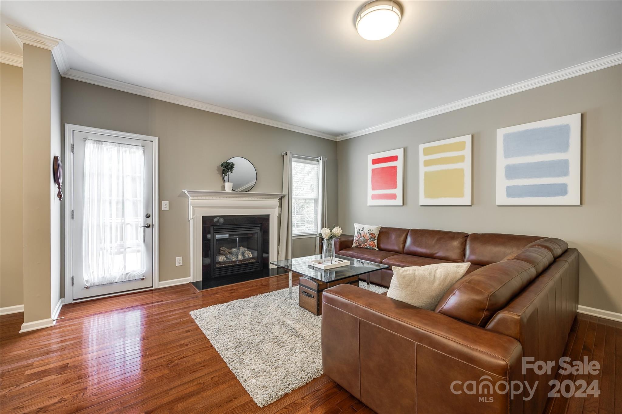 127 Inlet Point Drive Fort Mill, SC 29708 - Photo 4 of 46 a living room with furniture and a fireplace