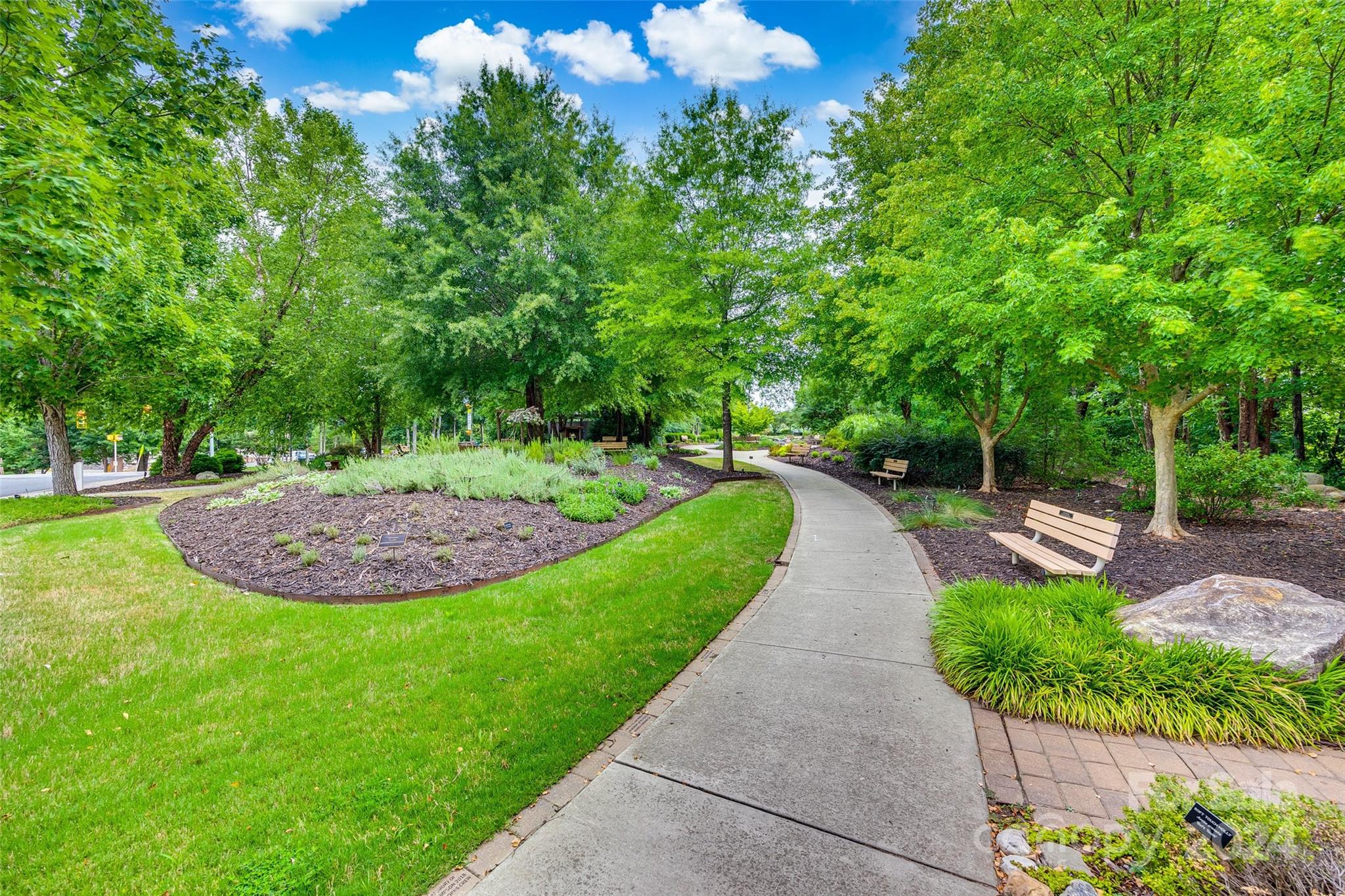 127 Inlet Point Drive Fort Mill, SC 29708 - Photo 44 of 46 a view of a garden with a fountain