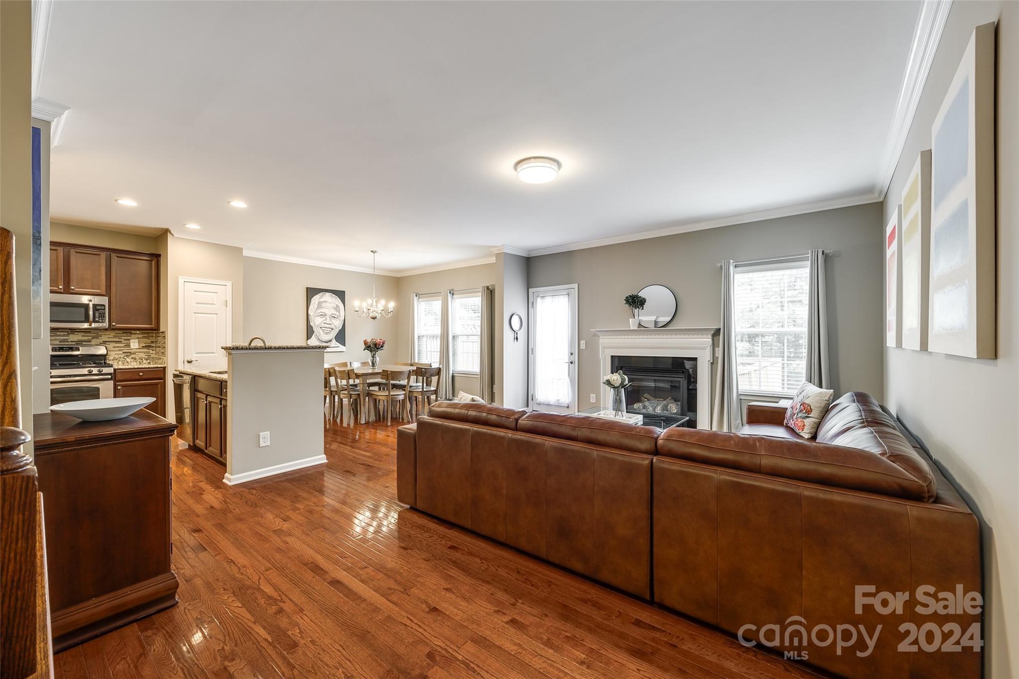 127 Inlet Point Drive Fort Mill, SC 29708 - Photo 6 of 46 a living room with furniture a fireplace and a flat screen tv