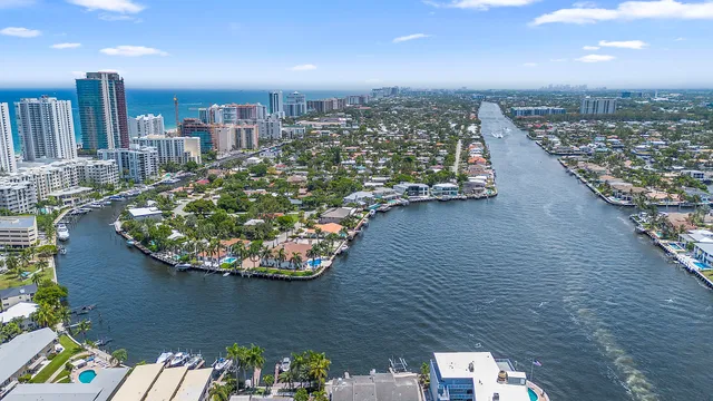 a sign on a street next to a building