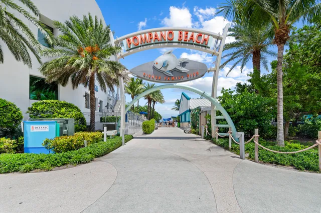 a view of a swimming pool with an outdoor seating