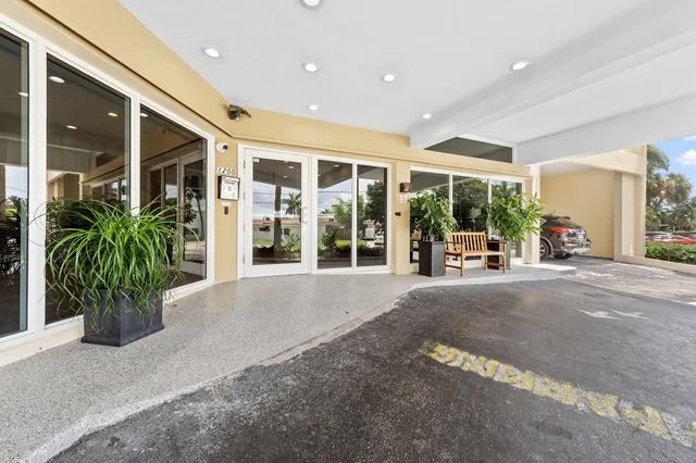 a view of a room with gym equipment and a large window