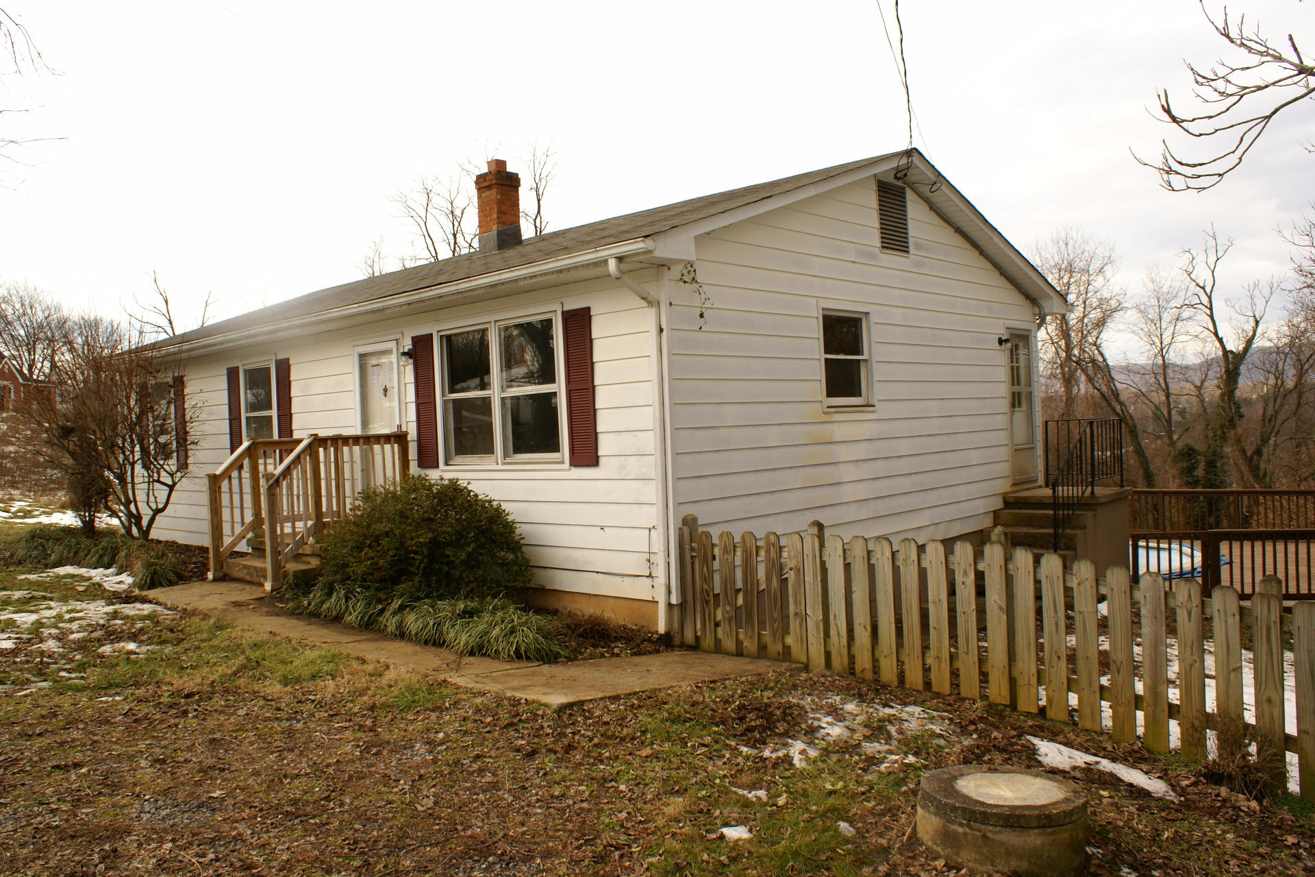 743 Colonial Road Blue Ridge, VA 24064 - Photo 3 of 20 a front view of a house with garden