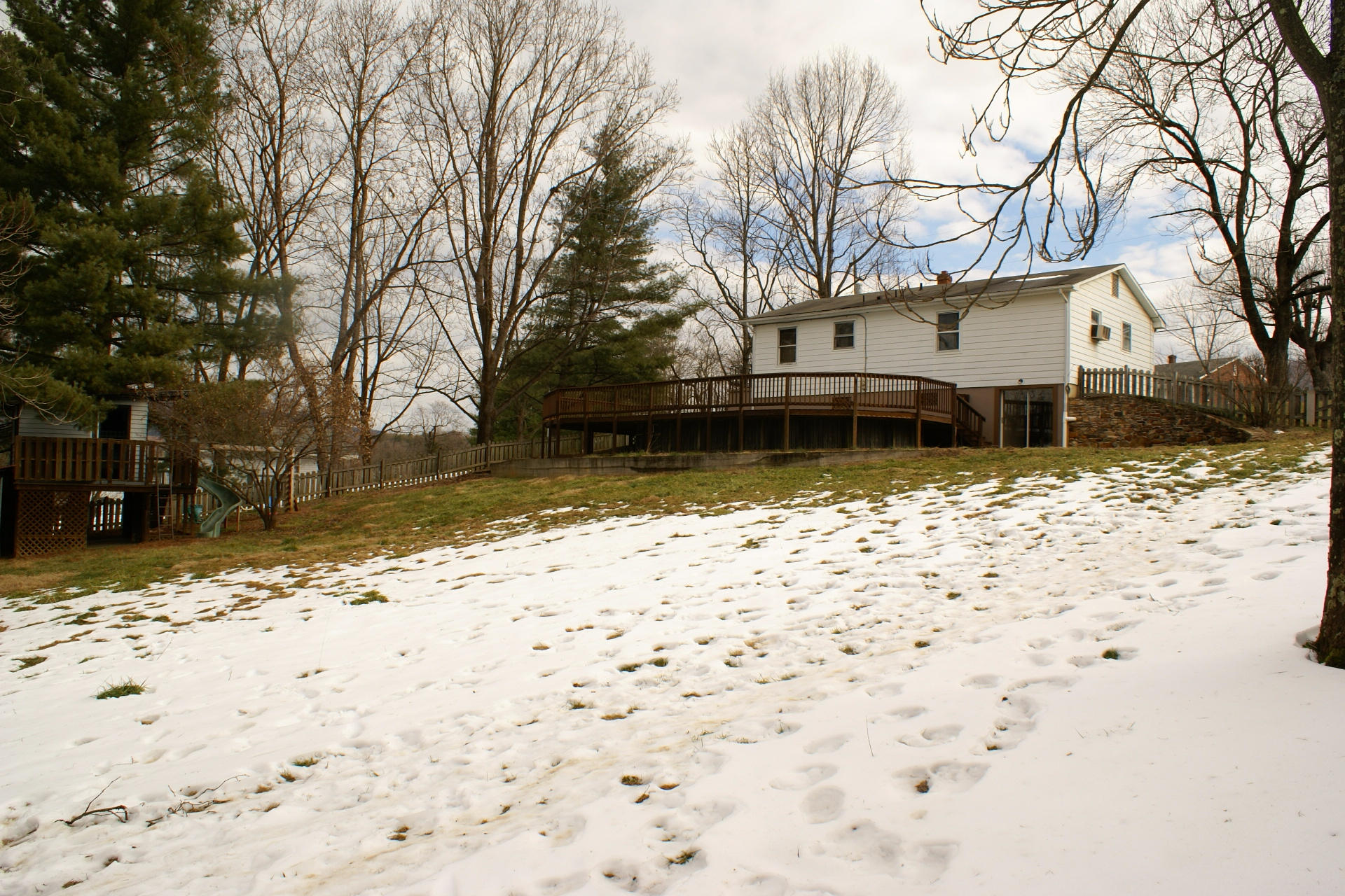 743 Colonial Road Blue Ridge, VA 24064 - Photo 5 of 20 a front view of a house with a yard covered in snow