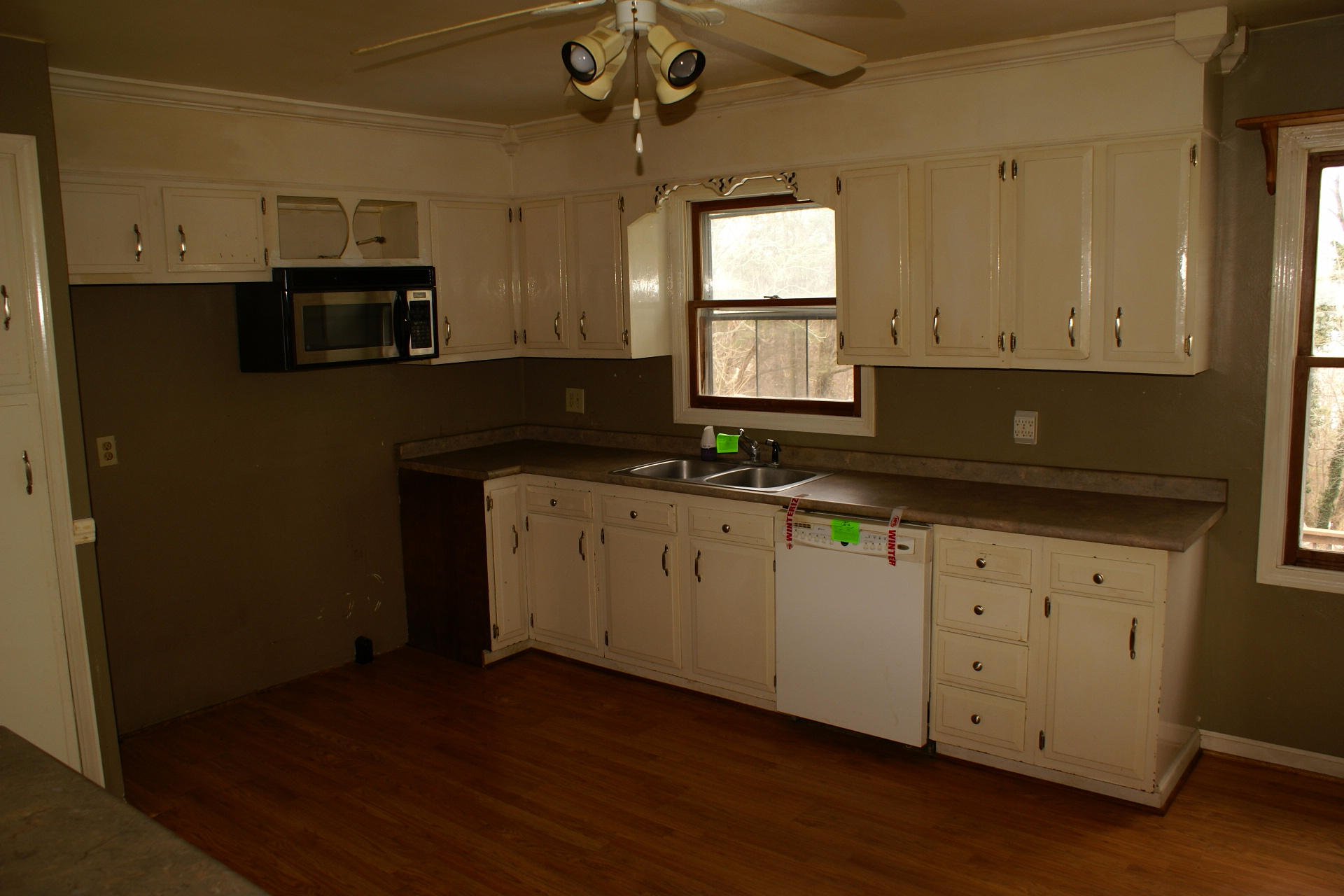 743 Colonial Road Blue Ridge, VA 24064 - Photo 8 of 20 a kitchen with granite countertop white cabinets and black stainless steel appliances
