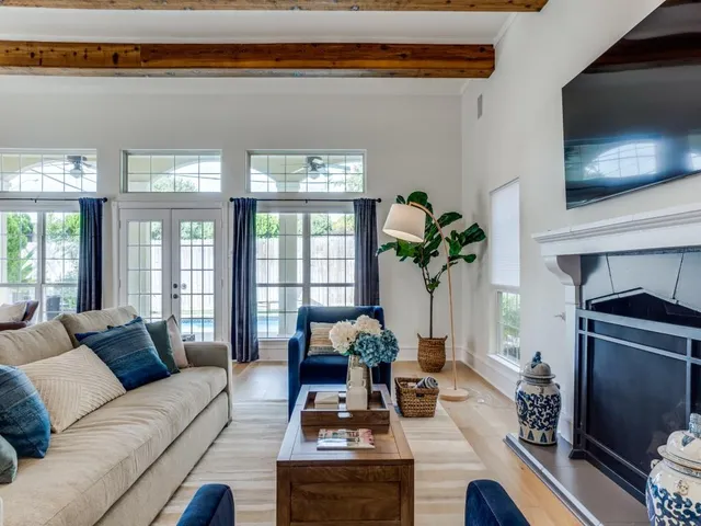 a living room with furniture fireplace and flat screen tv