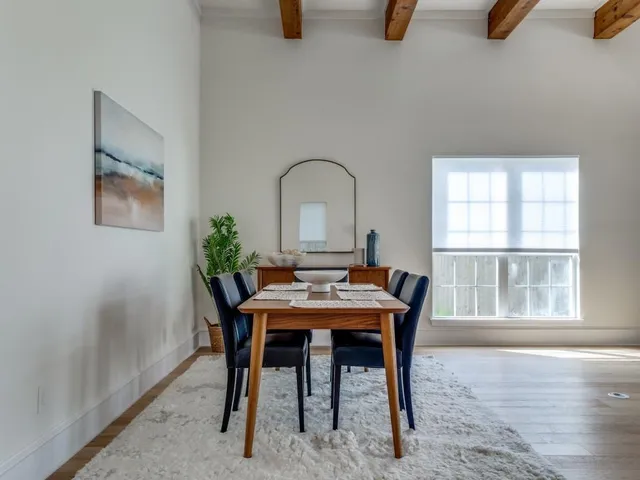 a dining room with furniture and window