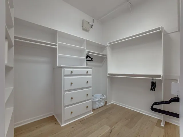 a view of an empty walk in closet