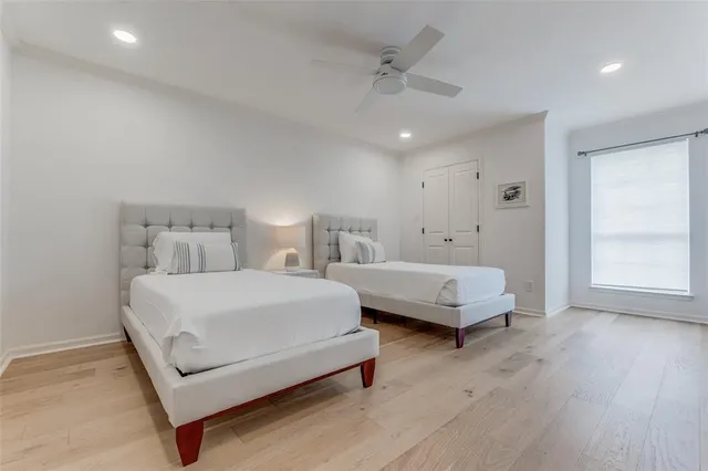 a bedroom with bed and a window