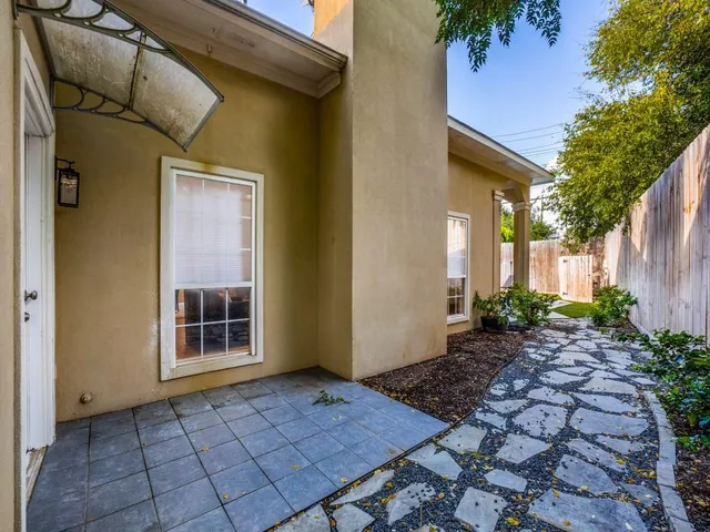 a view of a backyard of the house