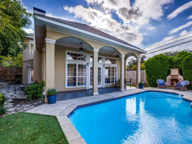 a view of swimming pool with outdoor seating