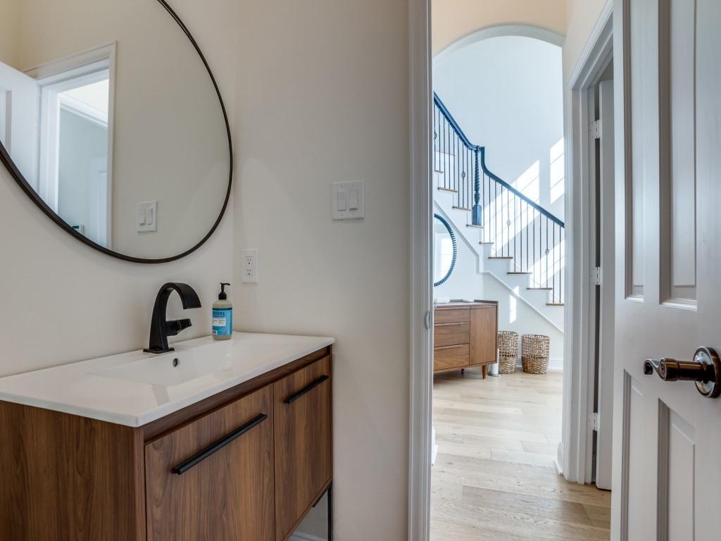 5305 Southern Avenue Dallas, TX 75209 - Photo 7 of 39 a bathroom with a sink and a mirror
