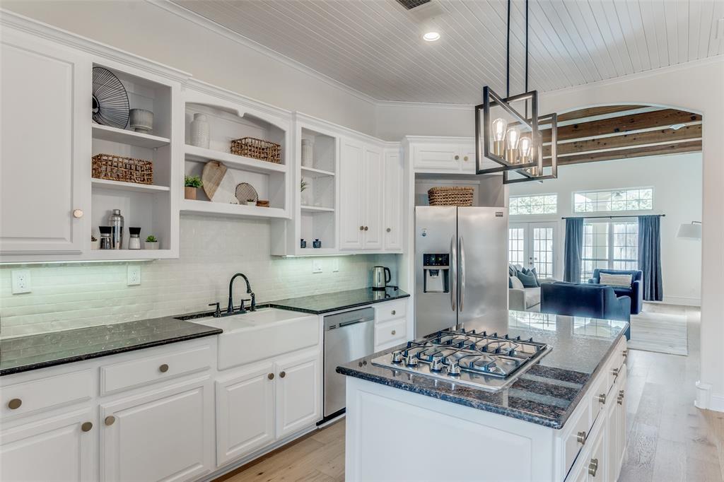 5305 Southern Avenue Dallas, TX 75209 - Photo 8 of 39 a kitchen with stainless steel appliances granite countertop a sink stove and refrigerator