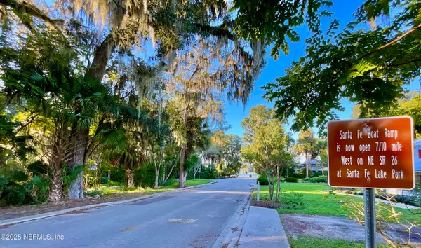 a view of a street with a tree