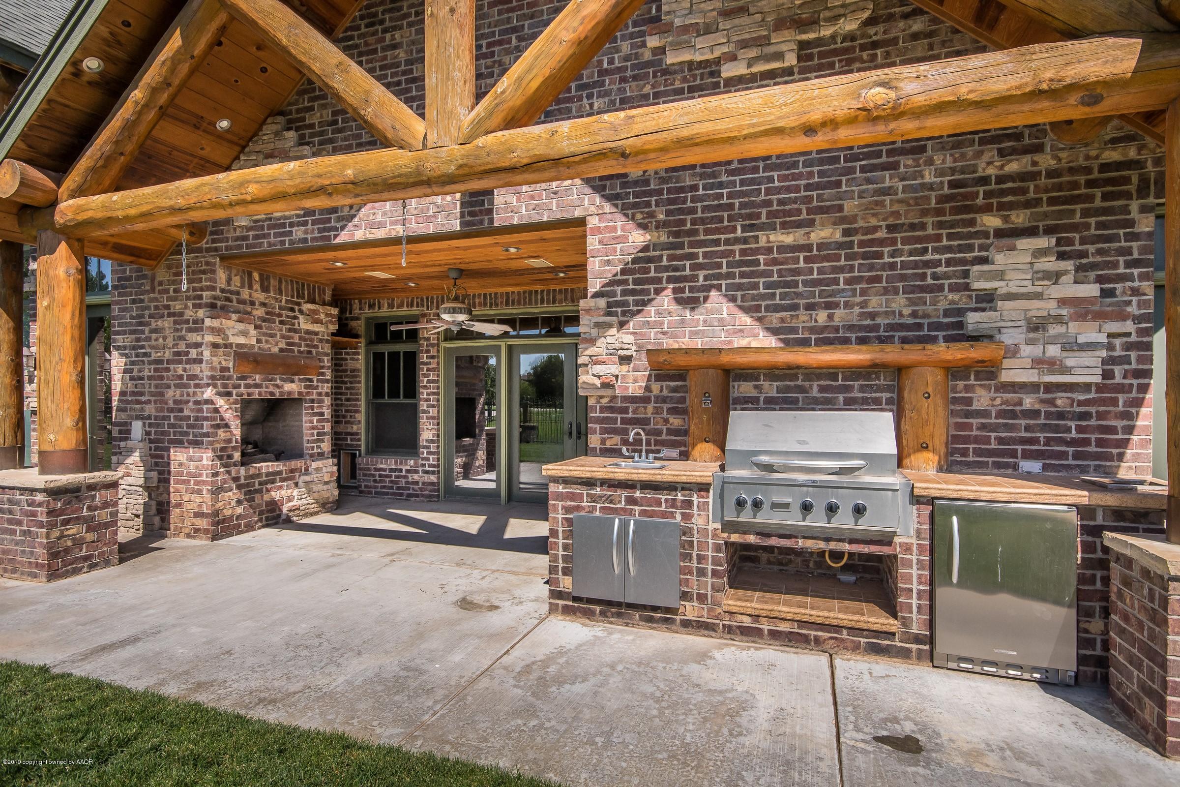 7800 Bayswater Road Amarillo, TX 79119 - Photo 28 of 34 Patio Cooking Area and Fireplace