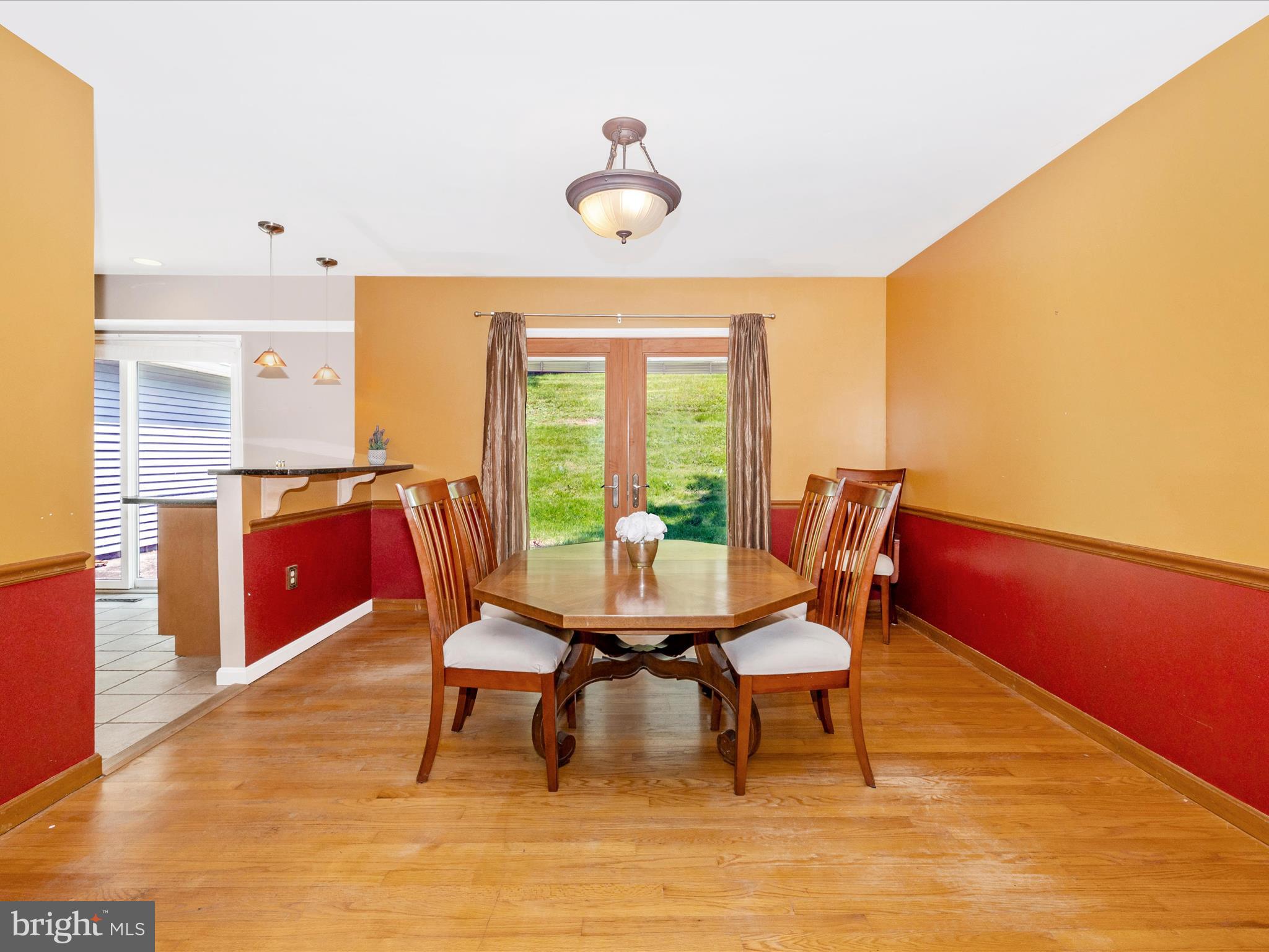 23933 Stringtown Road Clarksburg, MD 20871 - Photo 12 of 52 Dining Room has Chair Molding & Breakfast Bar