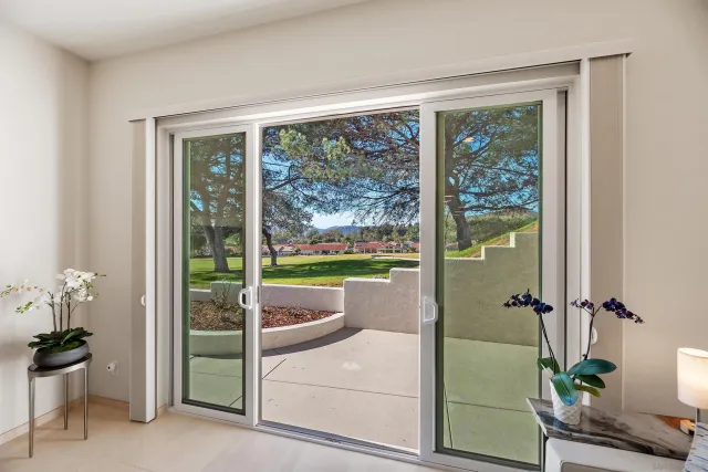 a view of room with balcony and entryway
