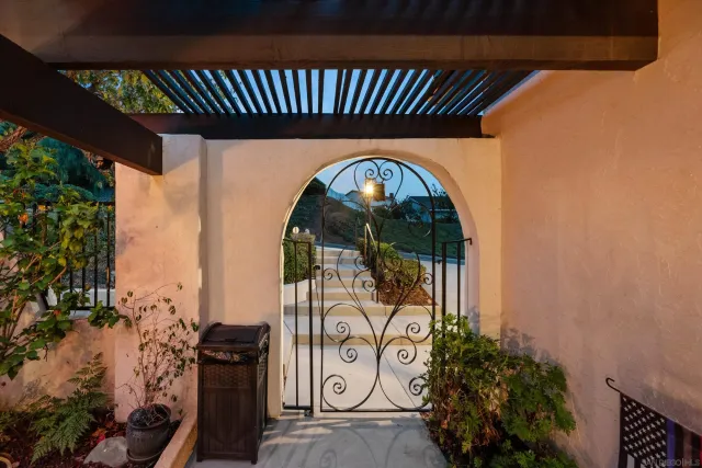 an outdoor view of shop with a table and chairs