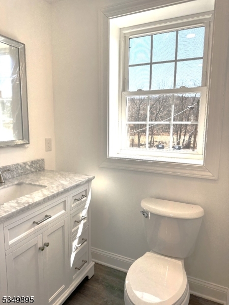 100 Stoll Street, Unit 2 Netcong, NJ 07857 - Photo 5 of 9 a bathroom with a toilet a sink and a window