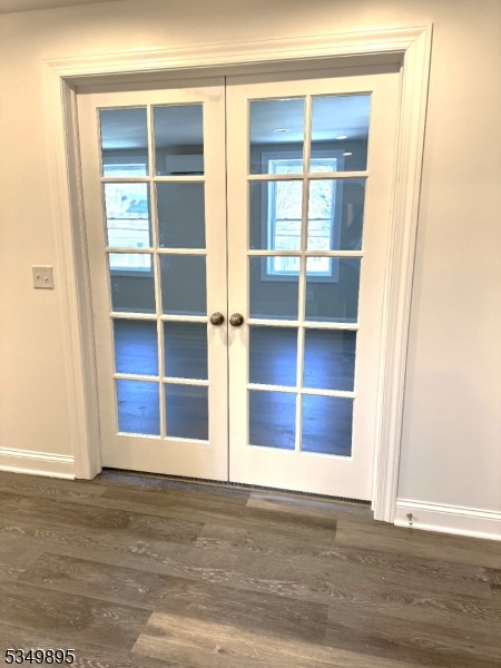 100 Stoll Street, Unit 2 Netcong, NJ 07857 - Photo 7 of 9 a view of an empty room with wooden floor and a window