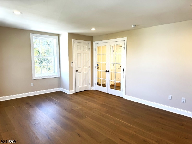 100 Stoll Street, Unit 2 Netcong, NJ 07857 - Photo 9 of 9 a view of an empty room with wooden floor and a window