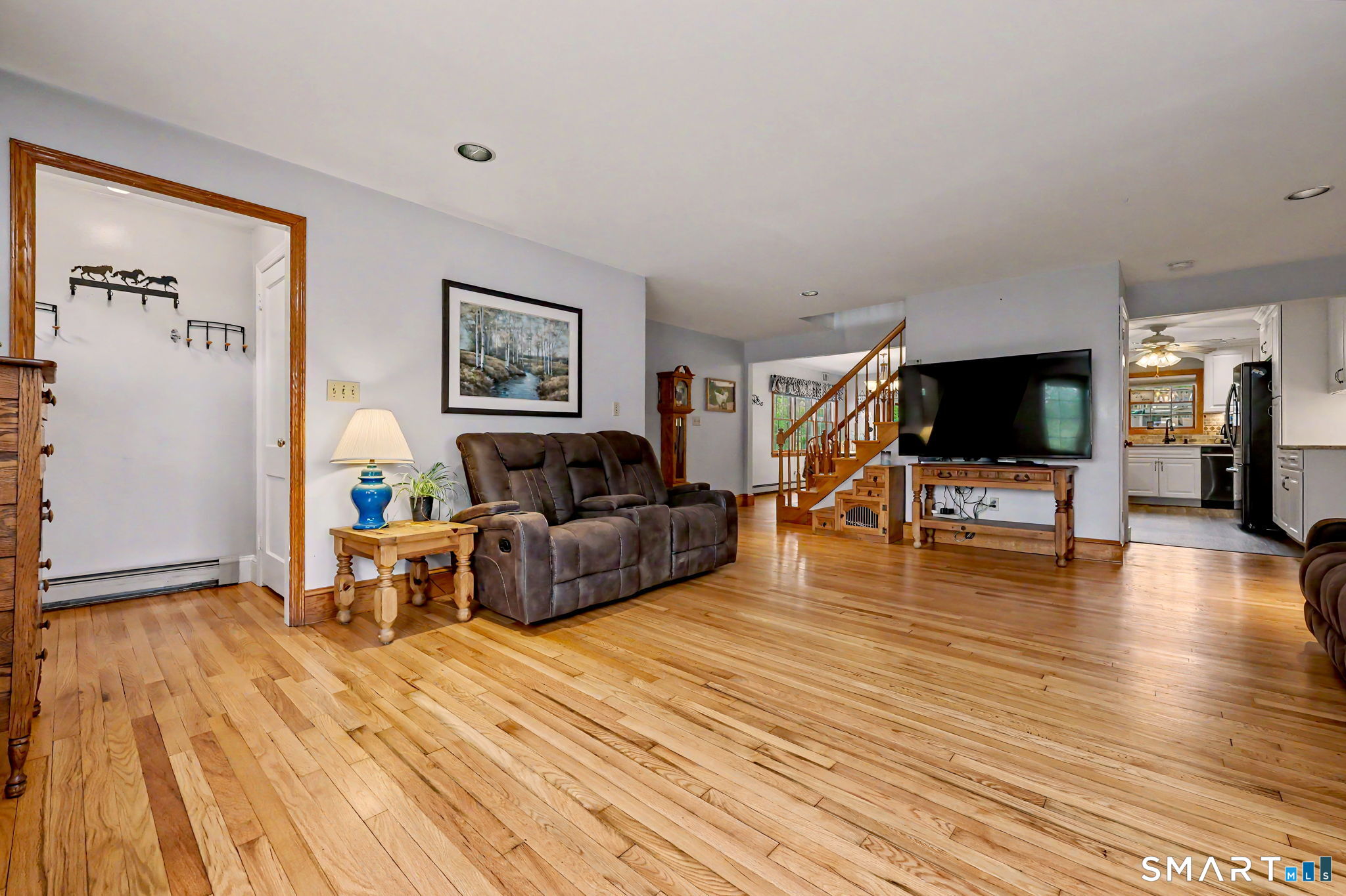 7 Merrill Road Trumbull, CT 06611 - Photo 7 of 40 a living room with furniture and a flat screen tv