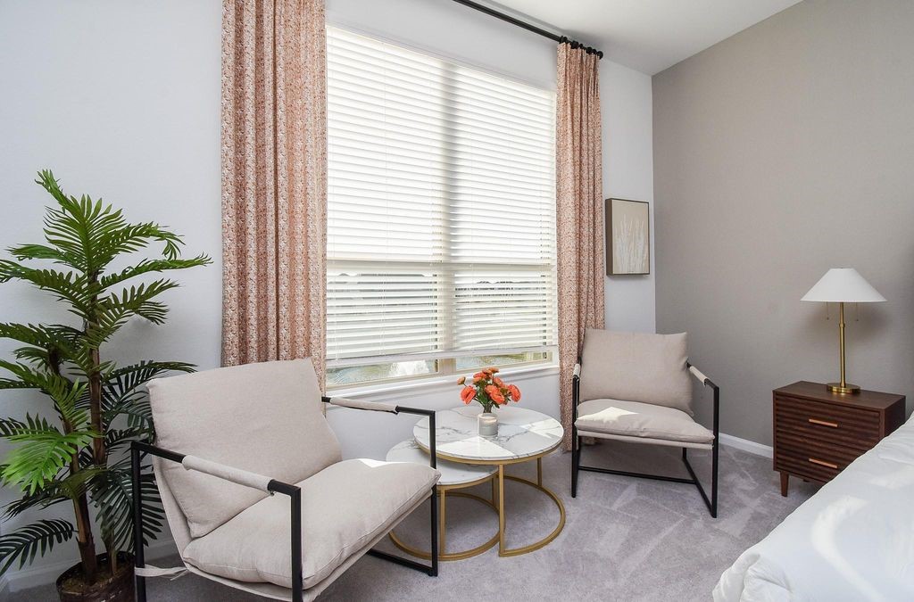 5618 Amber Brook Lane Fulshear, TX 77441 - Photo 14 of 17 a living room with furniture and a potted plant