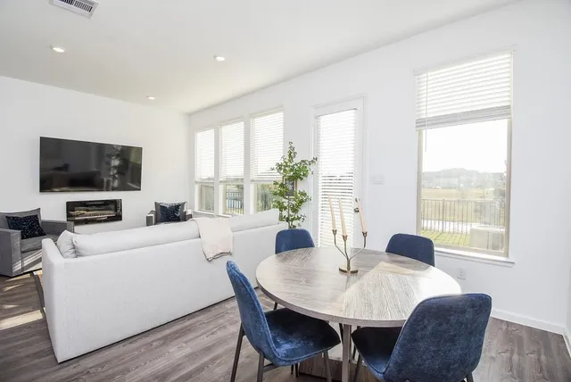 a view of a dining room with furniture window and outside view
