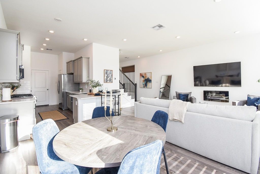5618 Amber Brook Lane Fulshear, TX 77441 - Photo 17 of 17 a living room with fireplace furniture and a flat screen tv