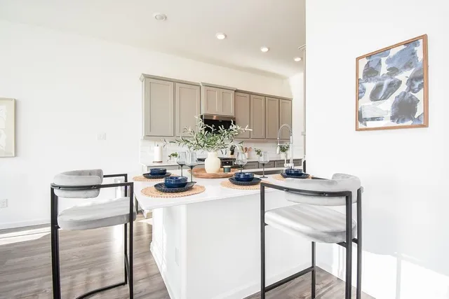 a kitchen with a sink stove and microwave