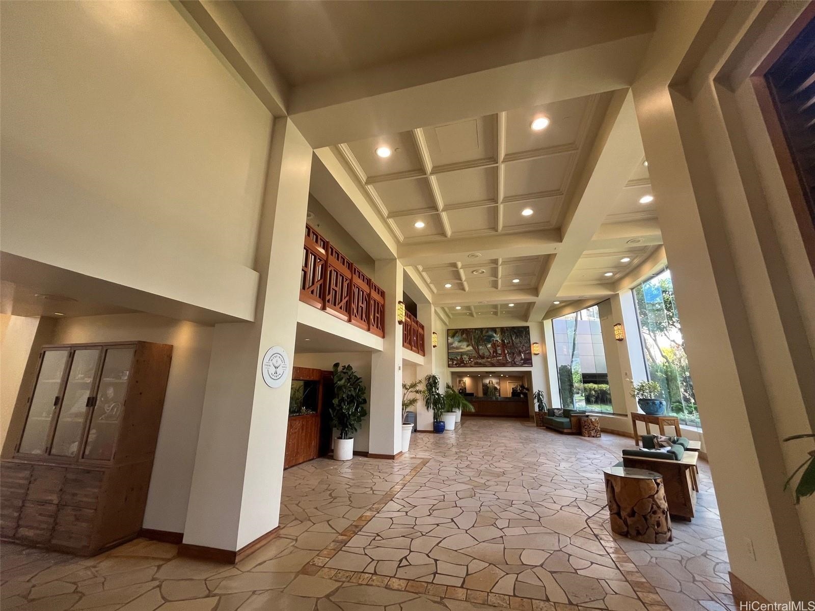 3445 Lower Honoapiilani Road, Unit 212 Lahaina, HI 96761 - Photo 12 of 39 a living room with furniture and a flat screen tv