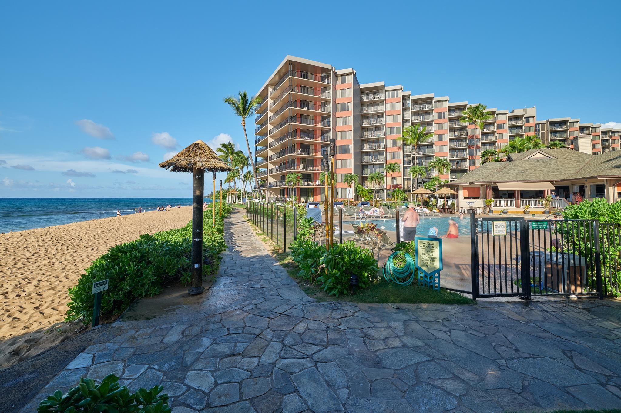 3445 Lower Honoapiilani Road, Unit 212 Lahaina, HI 96761 - Photo 17 of 39 a front view of a building with garden