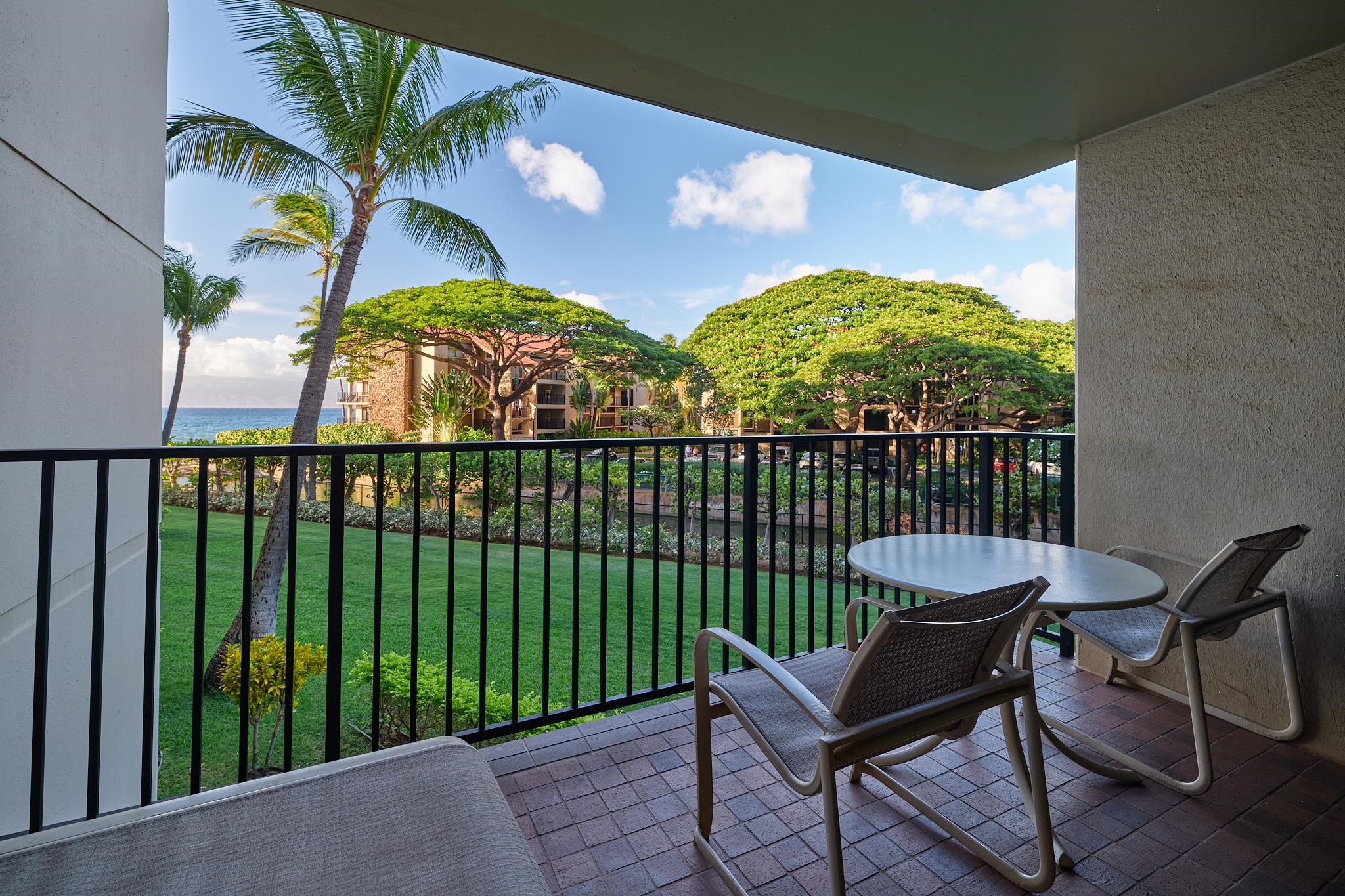 3445 Lower Honoapiilani Road, Unit 212 Lahaina, HI 96761 - Photo 22 of 39 a view of a chairs and table in patio