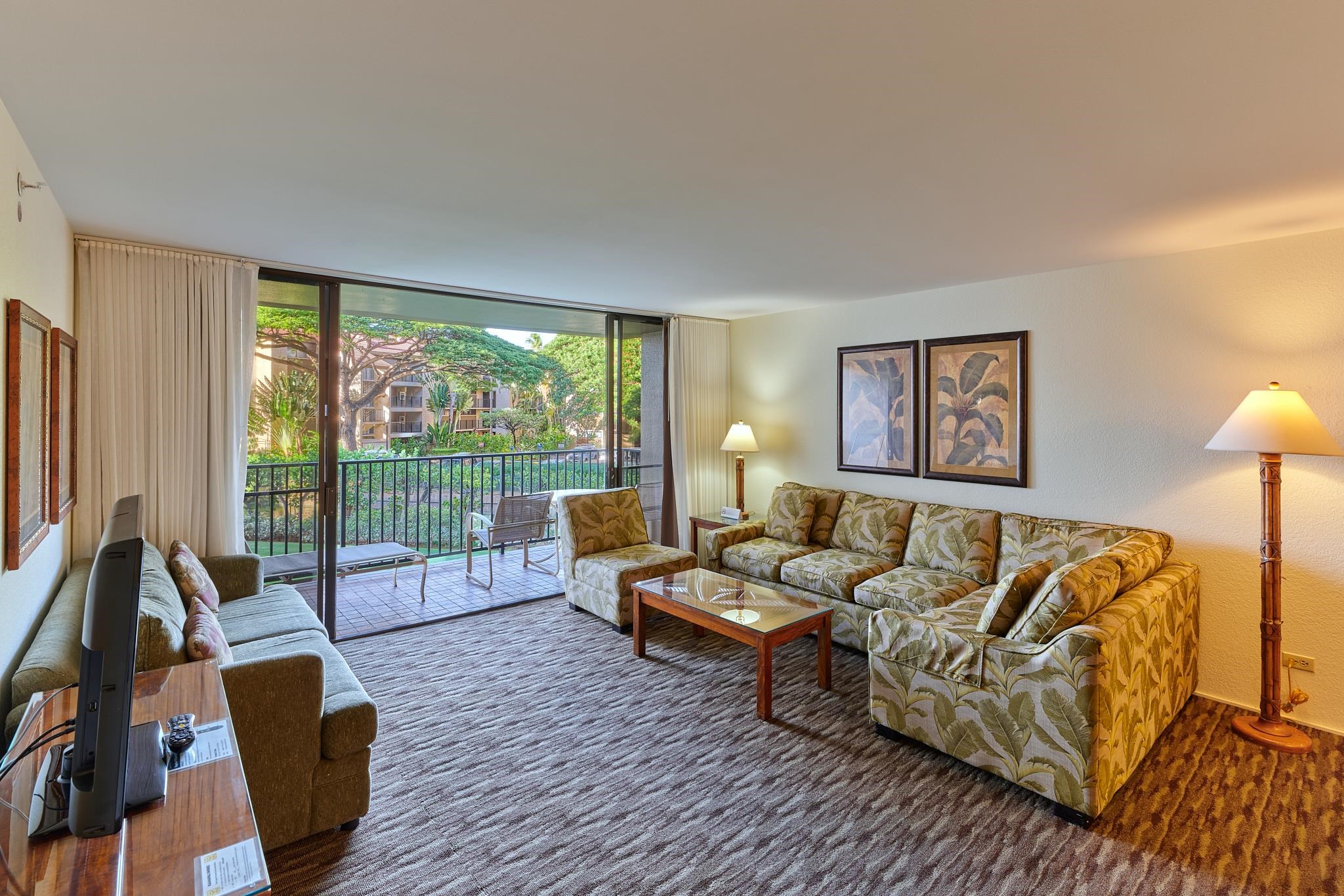 3445 Lower Honoapiilani Road, Unit 212 Lahaina, HI 96761 - Photo 23 of 39 a living room with furniture and a large window