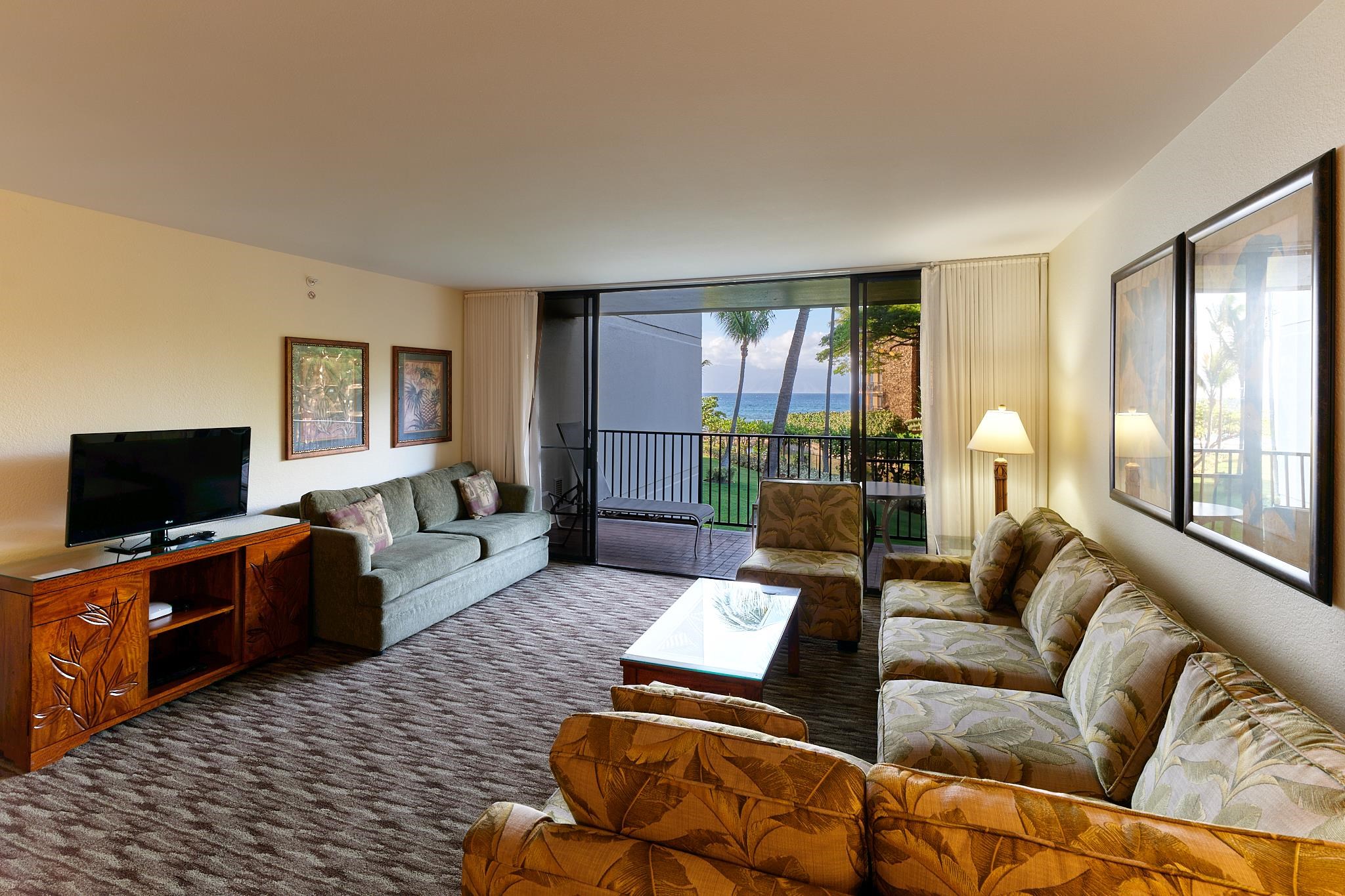 3445 Lower Honoapiilani Road, Unit 212 Lahaina, HI 96761 - Photo 25 of 39 a living room with furniture and a flat screen tv